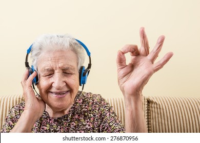 Senior Woman Listening Music