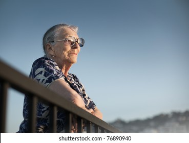 Senior Woman Looking Forward Over Blue Sky.