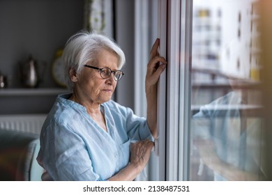 Senior woman looking out of window at home
 - Powered by Shutterstock