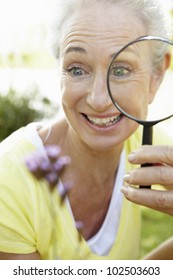 Senior Woman With Magnifying Glass