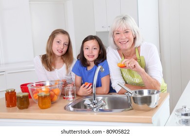 Senior Woman Making Apricot Jam With Grandkids