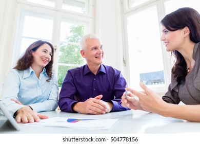 Senior Woman And Man At Retirement Financial Planning With Consultant Or Advisor