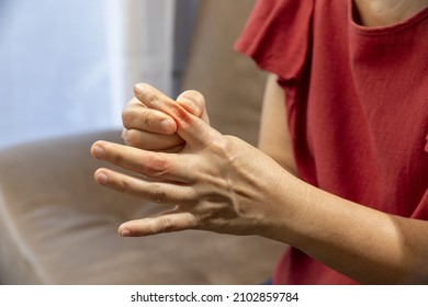 Senior Woman Massage Finger With Painful Swollen Gout