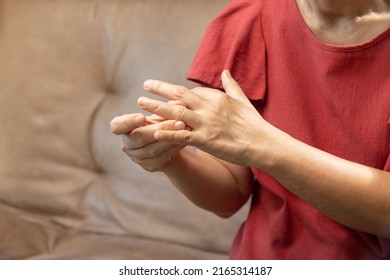 Senior Woman Massage Finger With Painful Swollen Gout Inflammation