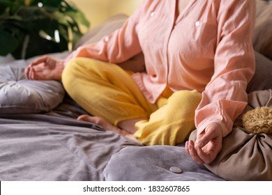 Senior Woman Meditating Practicing Yoga Indoors. Harmony, Yoga Practice, Balance, Meditation, Relaxation At Home