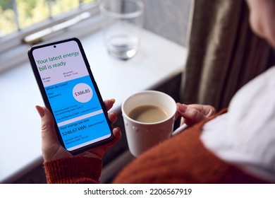 Senior Woman With Mobile Phone Looking At Online USA Energy Bill In Cost Of Living Energy Crisis