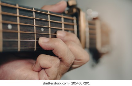 wooden guitar chord player