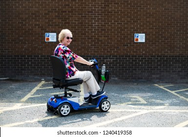 Senior woman on an electric wheelchair