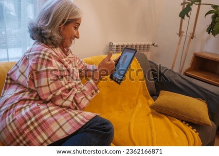 Female doctor showing an x-ray on the tablet