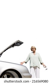 Senior Woman With Open Car Bonnet, Cut Out