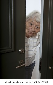 Senior Woman Opening Front Door