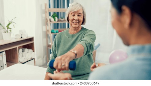 Senior woman, physiotherapy and dumbbell for exercise, support and stretching arm in physical therapy exam. Elderly patient and nurse with workout for shoulder pain, fitness and medical consultation - Powered by Shutterstock