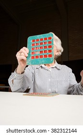 Senior Woman Playing Bingo