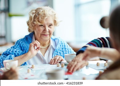 Senior Woman Playing Lotto With Friends