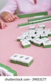 Senior Woman Playing Mahjong Game