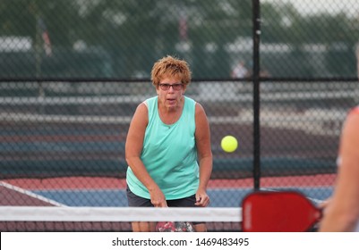 A Senior Woman Plays Pickle Ball