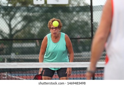 A Senior Woman Plays Pickle Ball