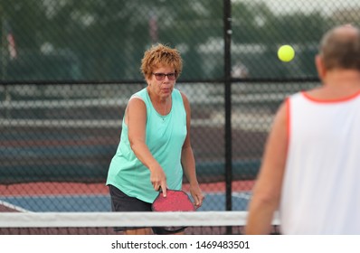 A Senior Woman Plays Pickle Ball