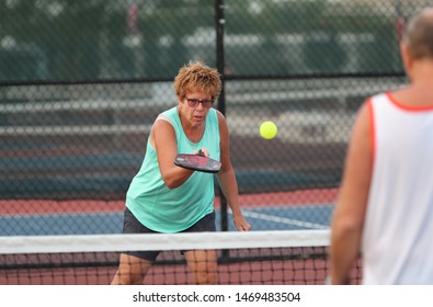 A Senior Woman Plays Pickle Ball