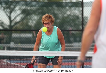 A Senior Woman Plays Pickle Ball