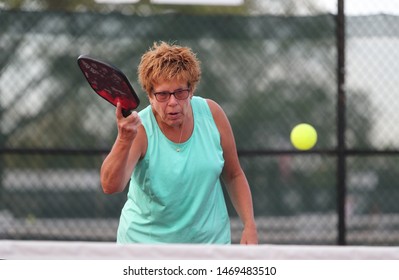 A Senior Woman Plays Pickle Ball