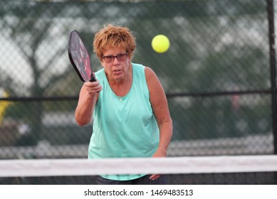 A Senior Woman Plays Pickle Ball