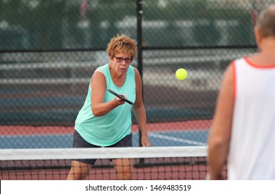 A Senior Woman Plays Pickle Ball