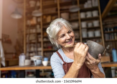 Senior Woman Pottery Artist Makes Ceramics From Clay
