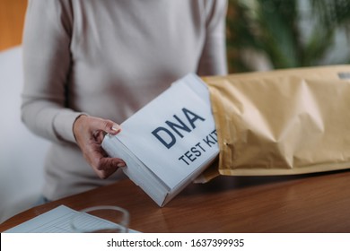 Senior Woman Preparing DNA Genetic Test Kit