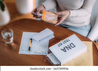 Senior Woman Preparing DNA Genetic Test Kit