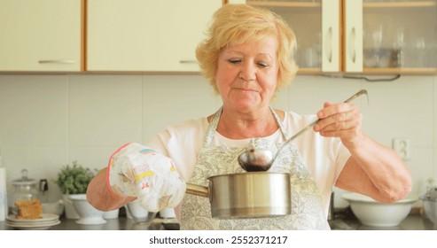 Senior woman preparing jam in kitchen - Powered by Shutterstock