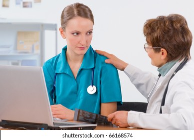 Senior Woman Professor Explain To A Young Female Medical Student