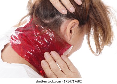 Senior Woman Putting A Cold Or Hot Compress On Her Neck In Front Of White Studio Isolated Background