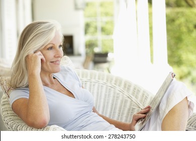 Senior Woman Reading Outside