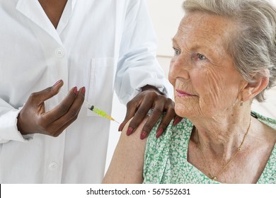 senior woman receiving vaccine 