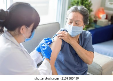 Senior Woman Receiving Vaccine. Medical Doctor Vaccinating An Elderly Patient Against Flu, Covid-19, Pneumonia Or Coronavirus.