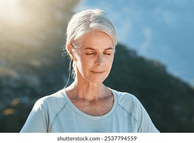 Senior, woman and relax with mountain for meditation, zen or inner peace for awareness in nature. Mature, female person or yogi with eyes closed for calm, stress relief or yoga in health and wellness - Powered by Shutterstock