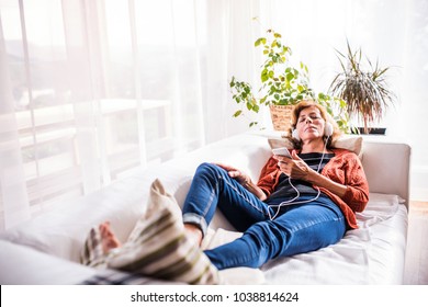Senior woman relaxing at home. - Powered by Shutterstock