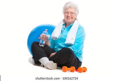 Senior Woman Resting After Exercises In Gym