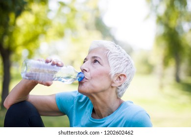 Asian Senior Male Pouring Water Bottle Stock Photo (Edit Now) 789955126