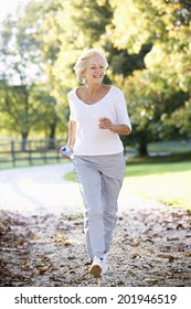 Senior Woman Running In Park