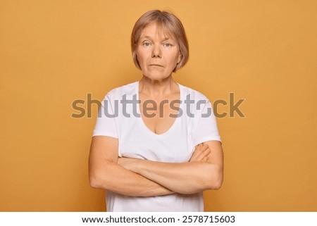 Similar – Image, Stock Photo Short-haired woman warms her hands with her breath in the autumn in the park