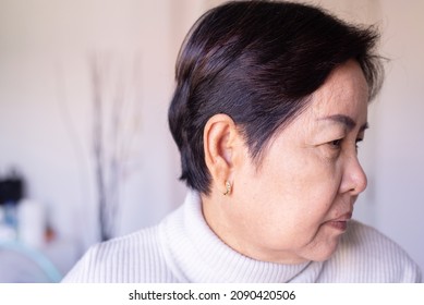 Senior Woman Showing Black Gray Hair Roots On Her Head,Close Up