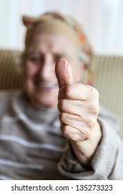 senior woman showing okay hand sign (gesture) and smiling for you