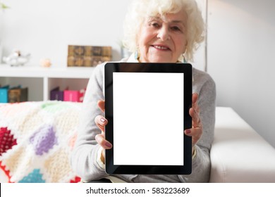 Senior Woman Showing Tablet Computer 