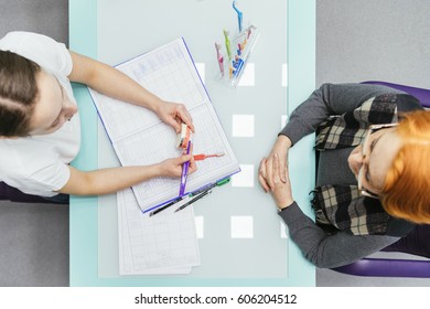 Senior Woman Sitting In A Chair In A Dental Consultation