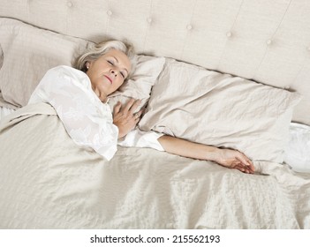 Senior Woman Sleeping In Bed