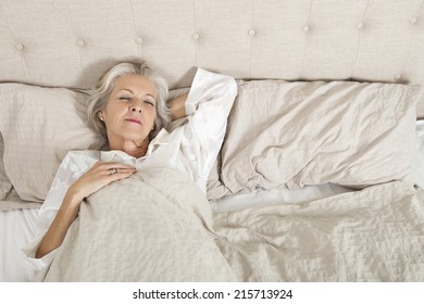 Senior Woman Sleeping In Bed