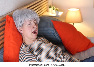 Senior Woman Snoring In Bed