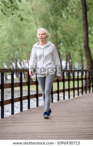 Similar – Porträt einer jungen Frau geht als Training nach draußen.